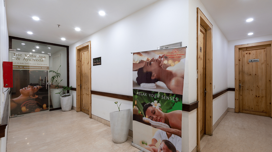 entrance of the spa with a banner featuring treatments at DLS The Classio